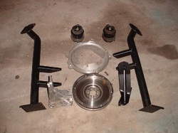 NEW Engine Mounting Kit to install 1998 and up 06A/038 Style 4-Cylinder Gasoline/Diesel Engine into T3 Vanagon in upright 15-Degree configuration. Comes with New Special Flywheel and Adapter Plate, Hydraulic Motor Mounts and all new nuts/bolts. Uses Stock 228mm Vanagon Clutch (not included). Can also be used on earlier 068, 028 and 058 style engine blocks with some modification of the right side steel mounting bracket seen in pic to the right of flywheel.