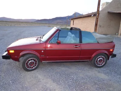 Red VW Cabriolet with the top down