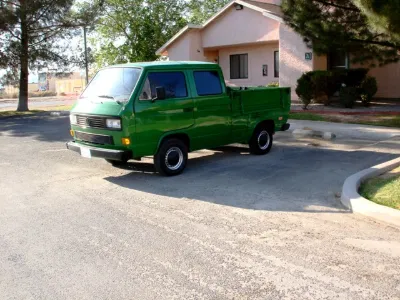 Green VW T3 double-cab pickup, side view