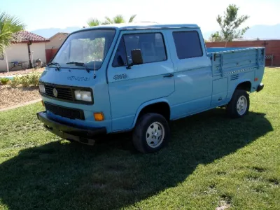 Light blue VW T3 double-cab pickup